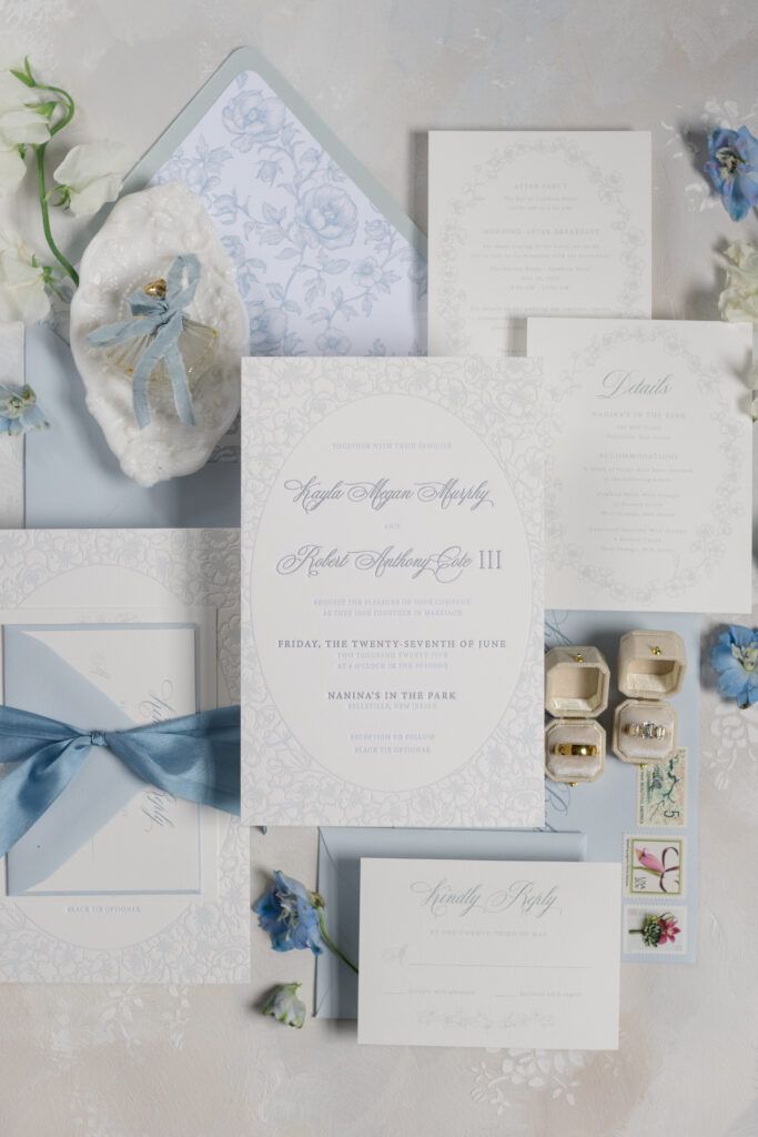 Monochromatic blue floral wedding invitation suite with silk ribbon