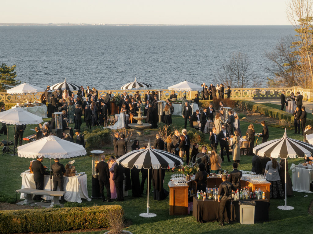 Outdoor cocktail hour overlooking the water at Hempstead House