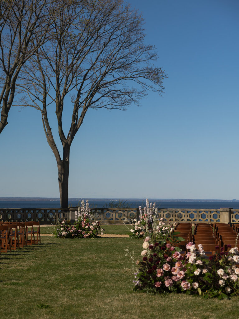 Outdoor wedding ceremony at Hempstead House in Sands Point, New York