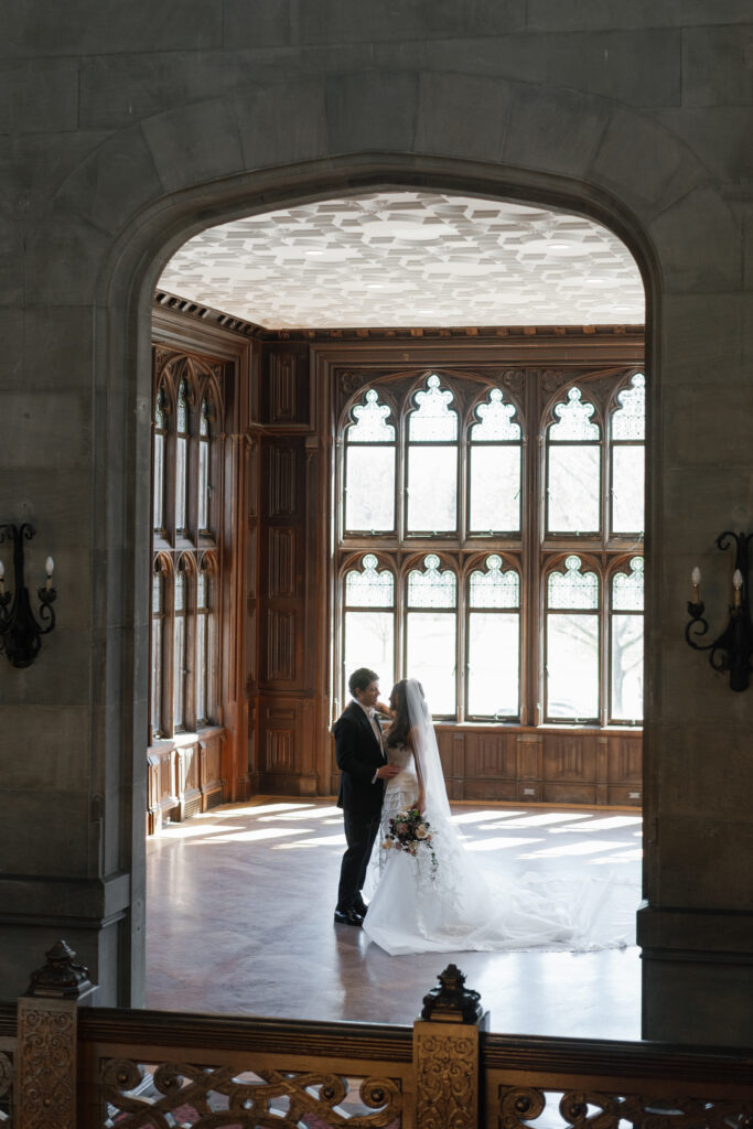 Bride and groom wedding portrait inside the historic Hempstead House at Sands Point Preserve
